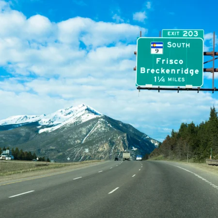 colorado highway sign showing exit 203 for breckenridge and frisco - high country oxygen delivery service in summit county area